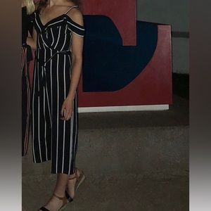 A Byer striped jumpsuit; fits like a 4